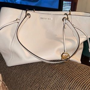 Michael Kors, off white purse, gold accents, draw strings to change shape